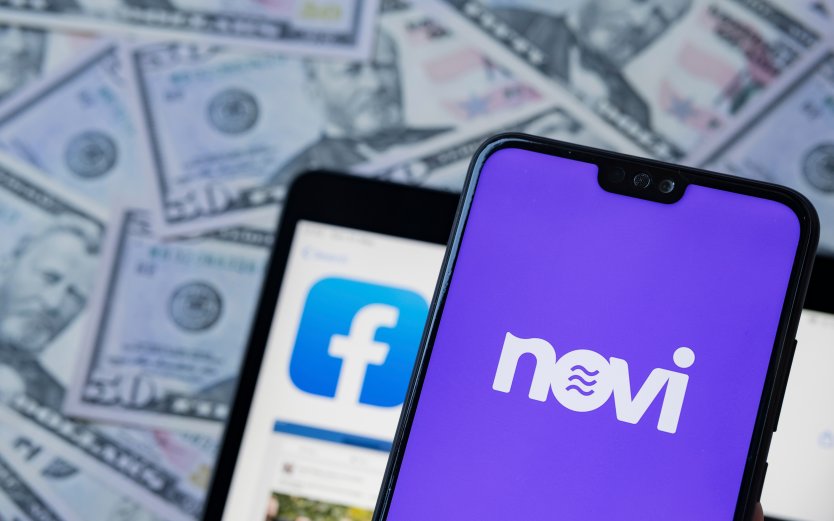 Novi logo and facebook app on smartphones in front of US currency
