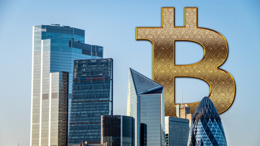 A view of skyscrapers dwarfed by a giant Bitcoin symbol
