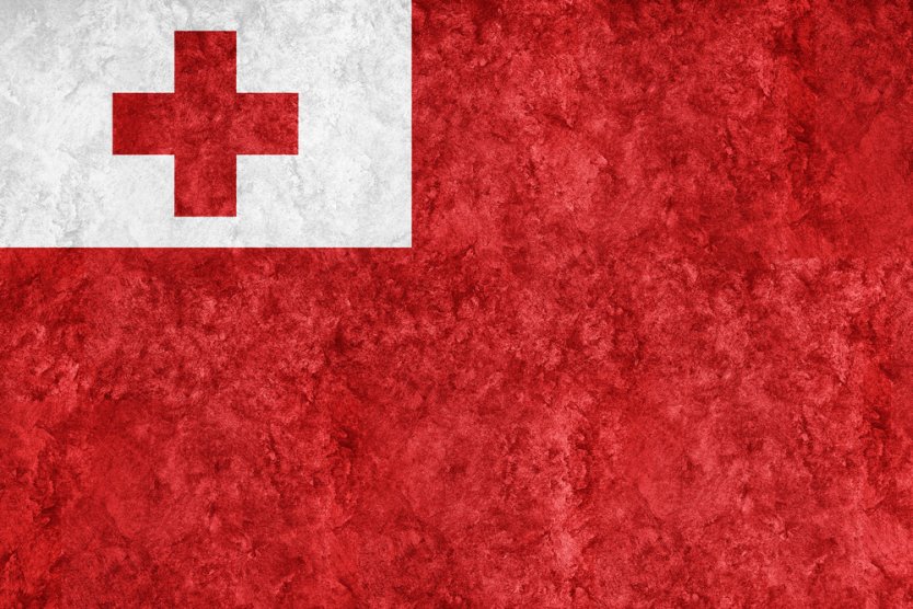 The Flag of Tonga, which features a red cross in a small white rectangle on a red background