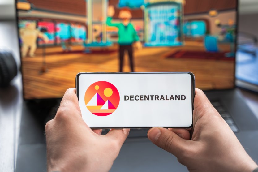 Dencentraland logo shown on a smartphone