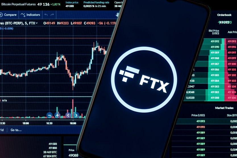FTX token in front of a stock chart