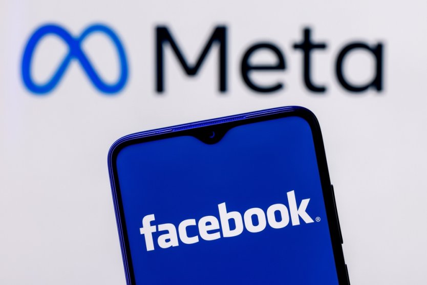 Meta logo and Facebook logo on a smartphone screen