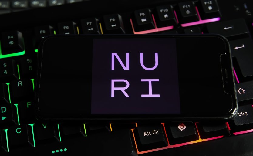 A smartphone displays the crypto bank Nuri’s name on its screen