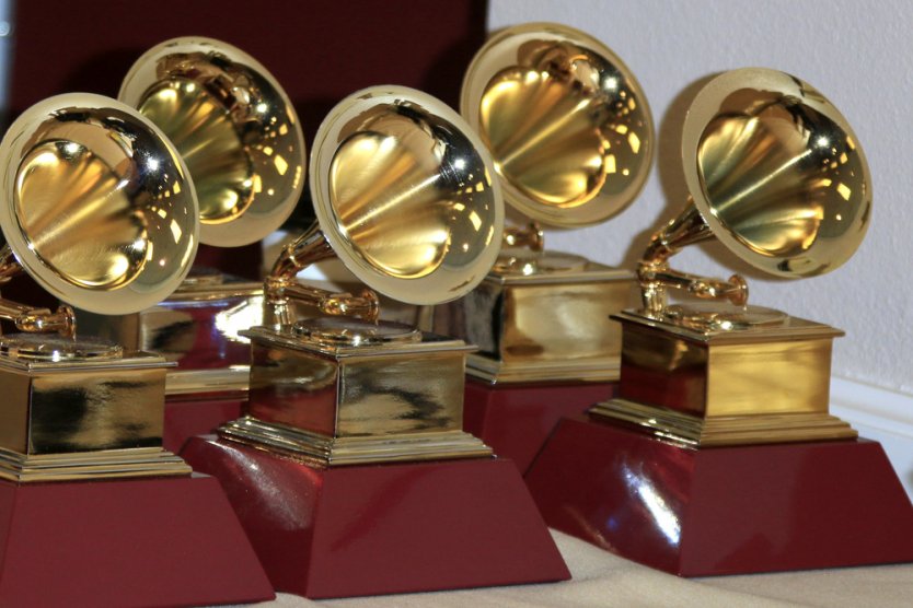 A set of GRAMMY Award statues grouped together on a table