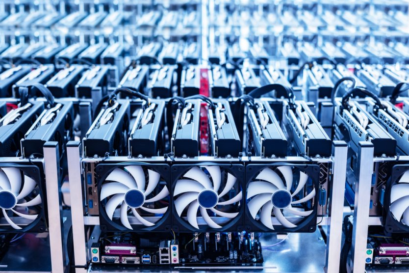 Bitcoin mining farm with banks of computers and cooling equipment